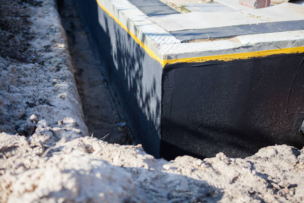 Professional Waterproofing technician working in Brookside, AL